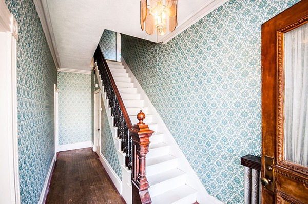 257 Market Street Boston, MA 02135 - Photo 8 of 16 a view of stairs with wooden floor