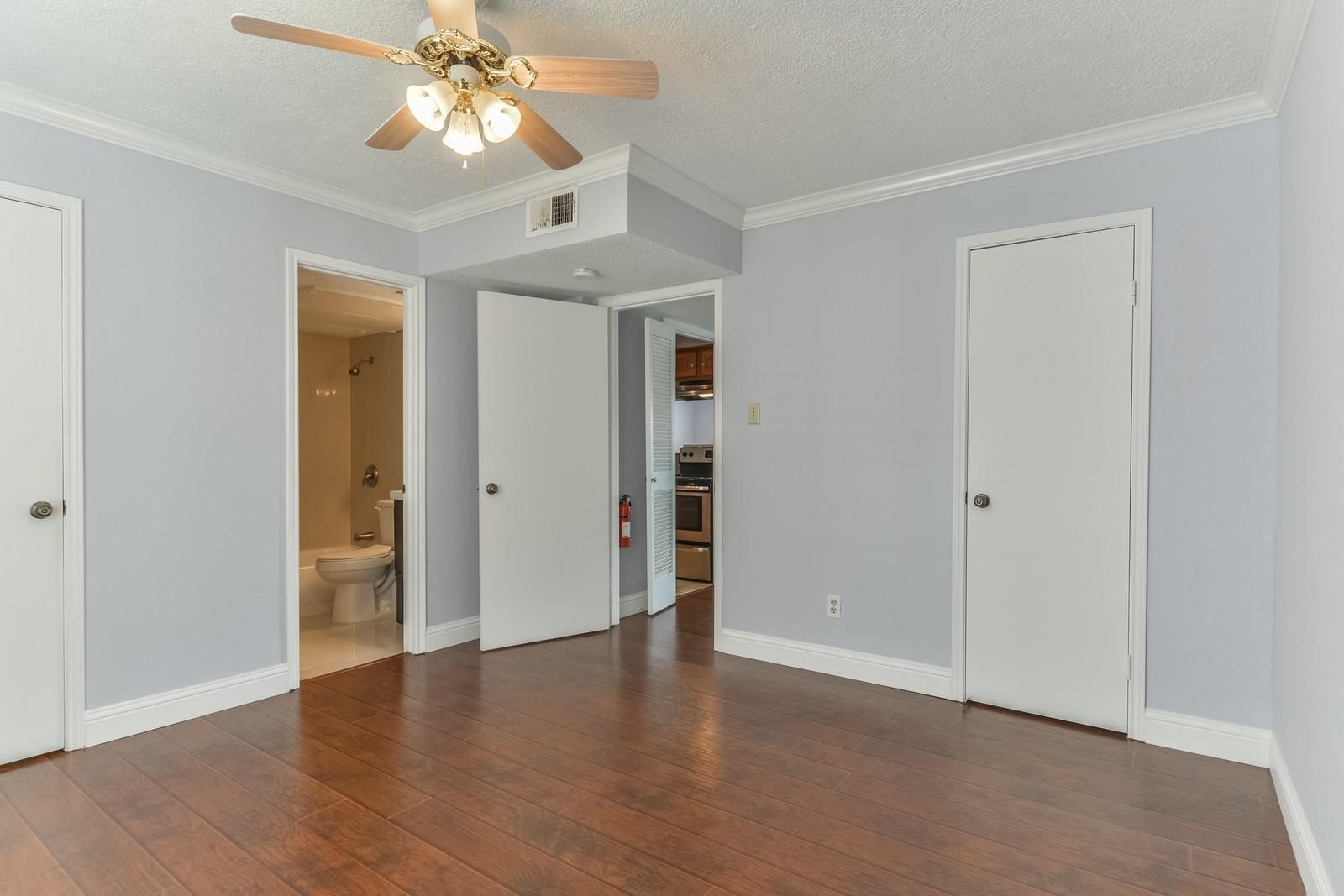 6402 Del Monte Drive, Unit 45 Houston, TX 77057 - Photo 12 of 20 wooden floor in an empty room with a window
