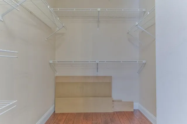 a view of an empty walk in closet