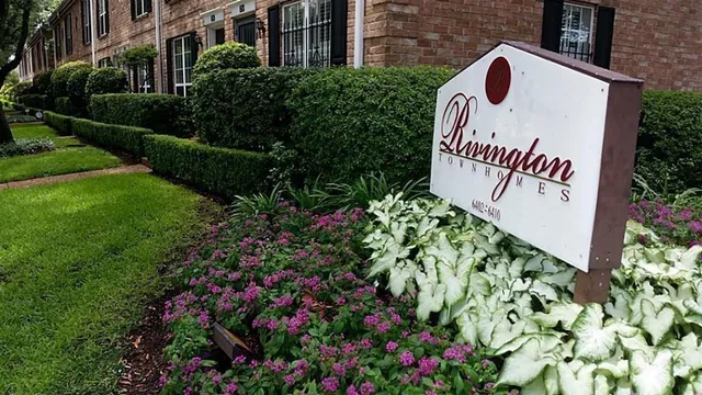 a view of a sign in front of house