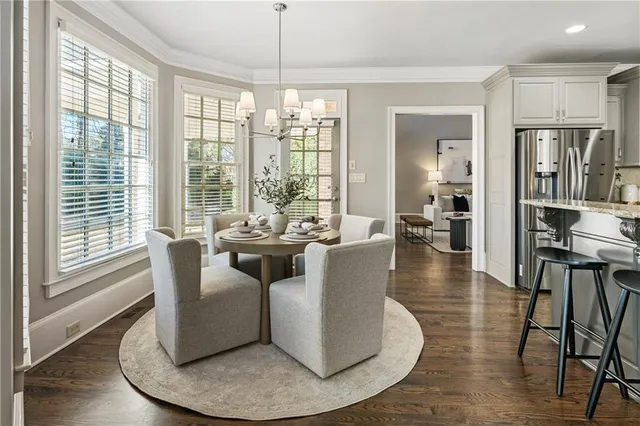a kitchen with granite countertop kitchen island wooden cabinets and stainless steel appliances