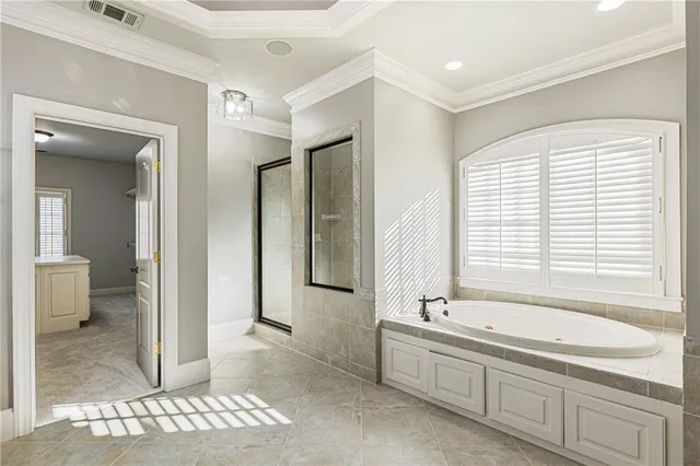 a view of kitchen with stainless steel appliances wooden floor and living room