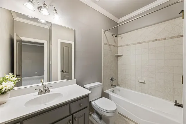 a living room with furniture and a air conditioner vent