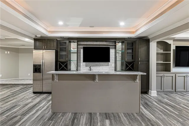 an aerial view of a house with a yard and trees