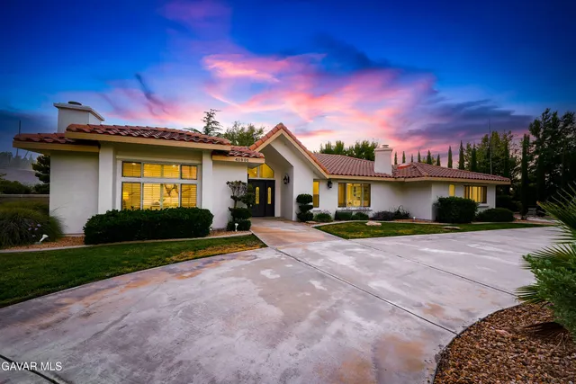 a view of house with outdoor space and yard