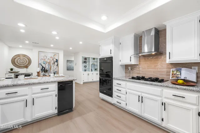 a bathroom with a double vanity sink a mirror and shower