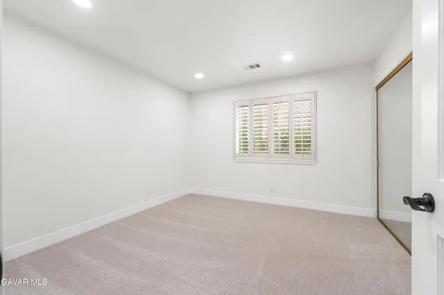 a view of cabinets and wooden floor