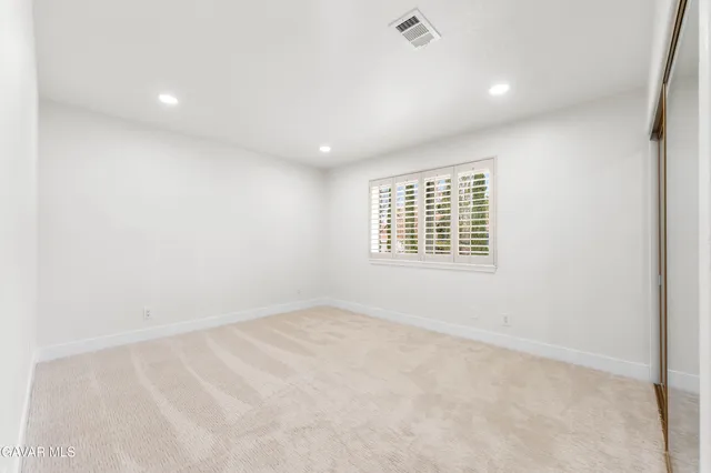 a bathroom with a sink a mirror and shower