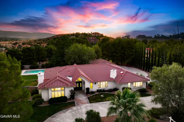 an aerial view of house with ocean view