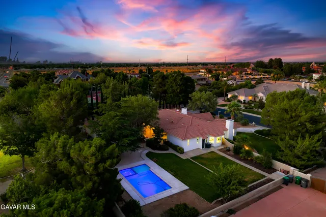 an aerial view of a house with a garden
