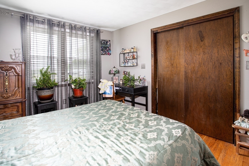 166 Stonehaven Road Fall River, MA 02723 - Photo 17 of 33 a bedroom with a bed potted plant and a window