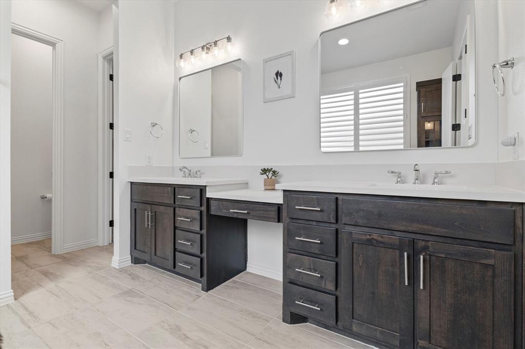 1561 William Way Dallas, TX 75234 - Photo 14 of 38 a bathroom with a sink vanity and mirror