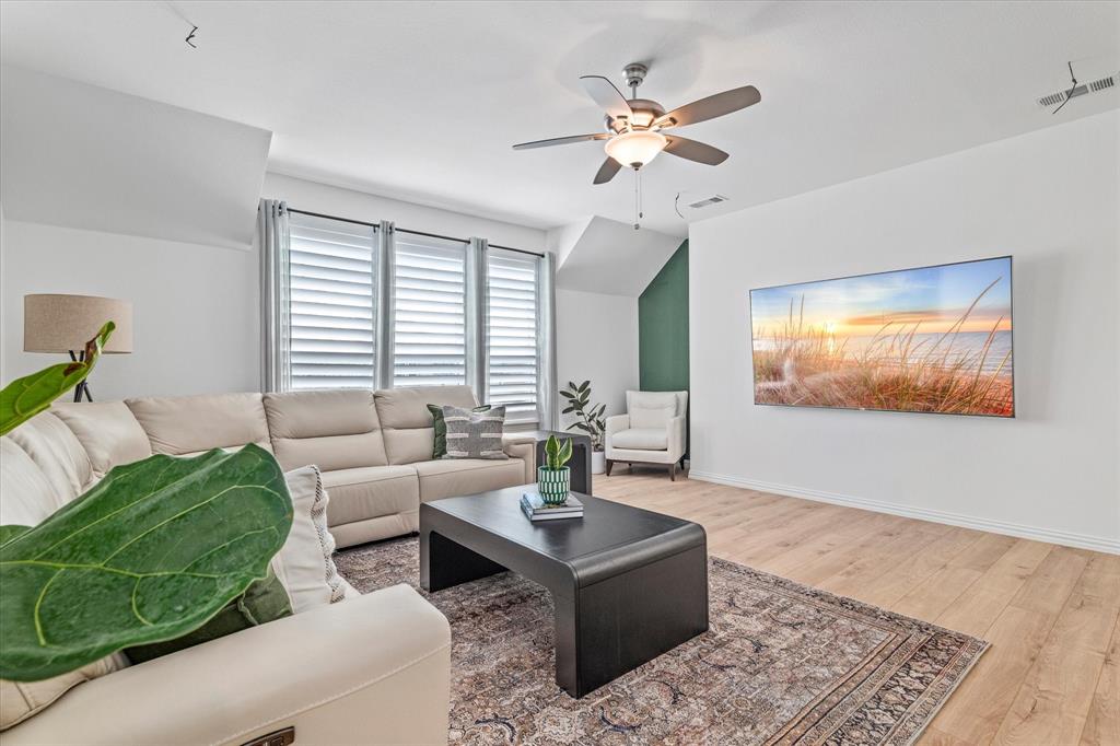 1561 William Way Dallas, TX 75234 - Photo 18 of 38 a living room with furniture and a chandelier