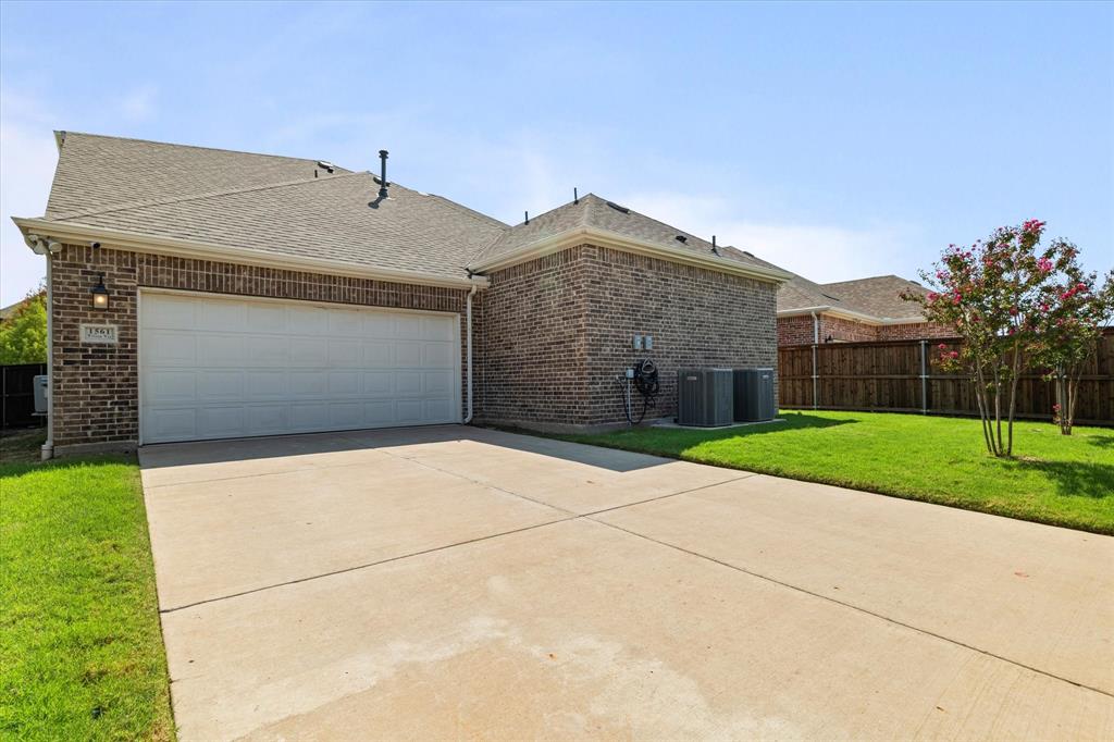 1561 William Way Dallas, TX 75234 - Photo 31 of 38 a front view of house with yard
