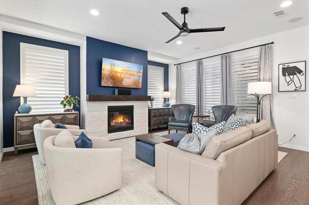 1561 William Way Dallas, TX 75234 - Photo 38 of 38 a living room with furniture a fireplace and a flat screen tv