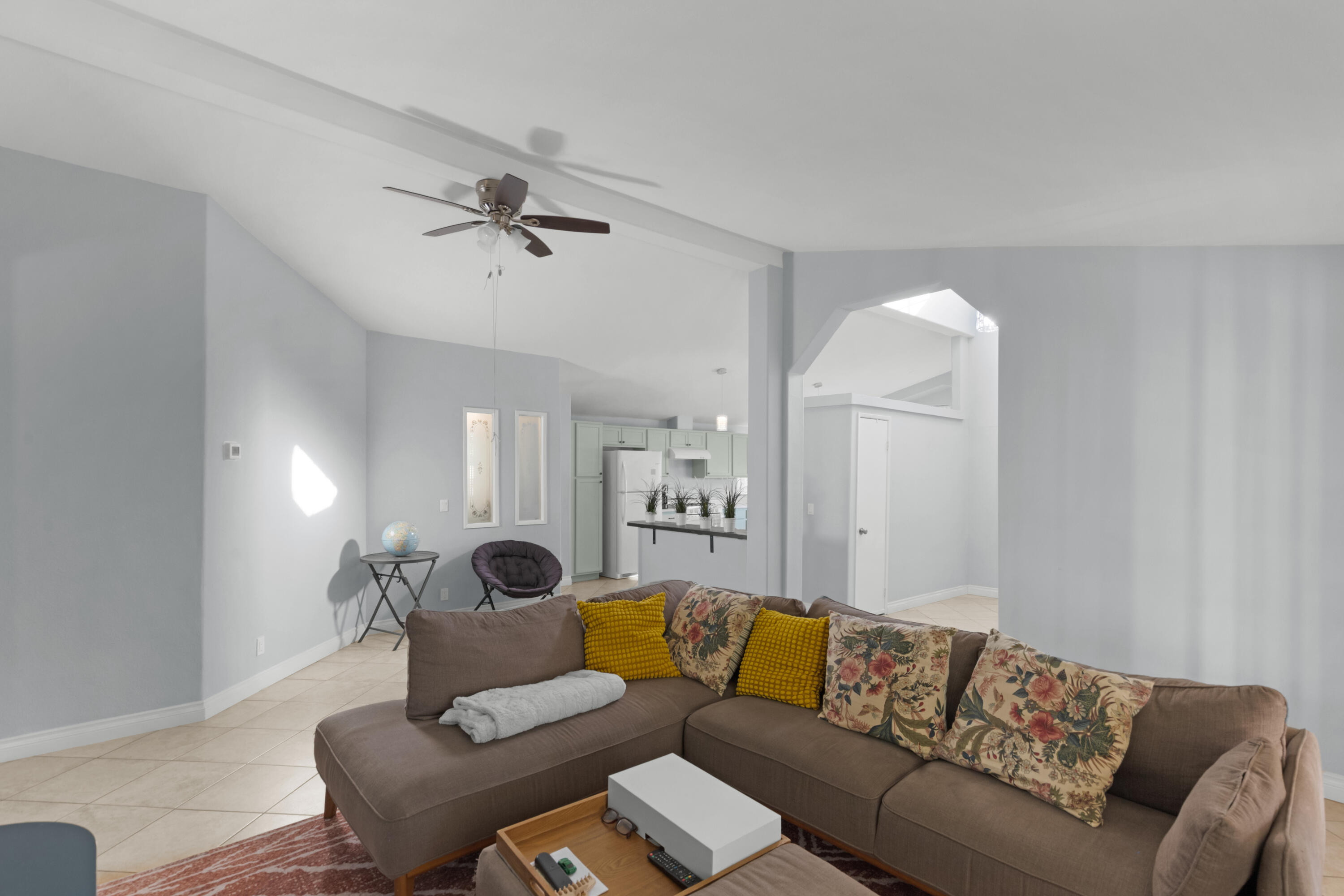 47800 Madison Street, Unit 44 Indio, CA 92201 - Photo 16 of 25 a living room with furniture and a ceiling fan
