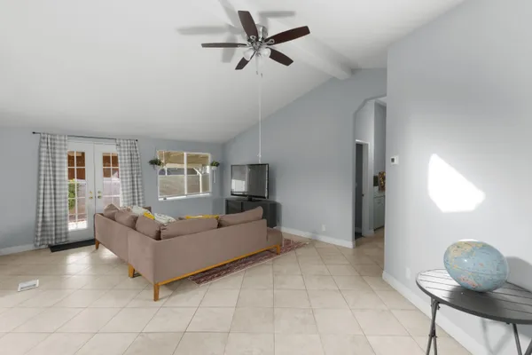 a living room with furniture and a window