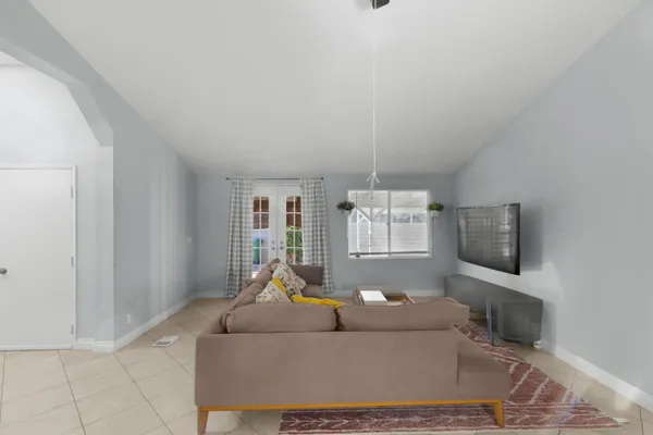 a living room with furniture and a flat screen tv