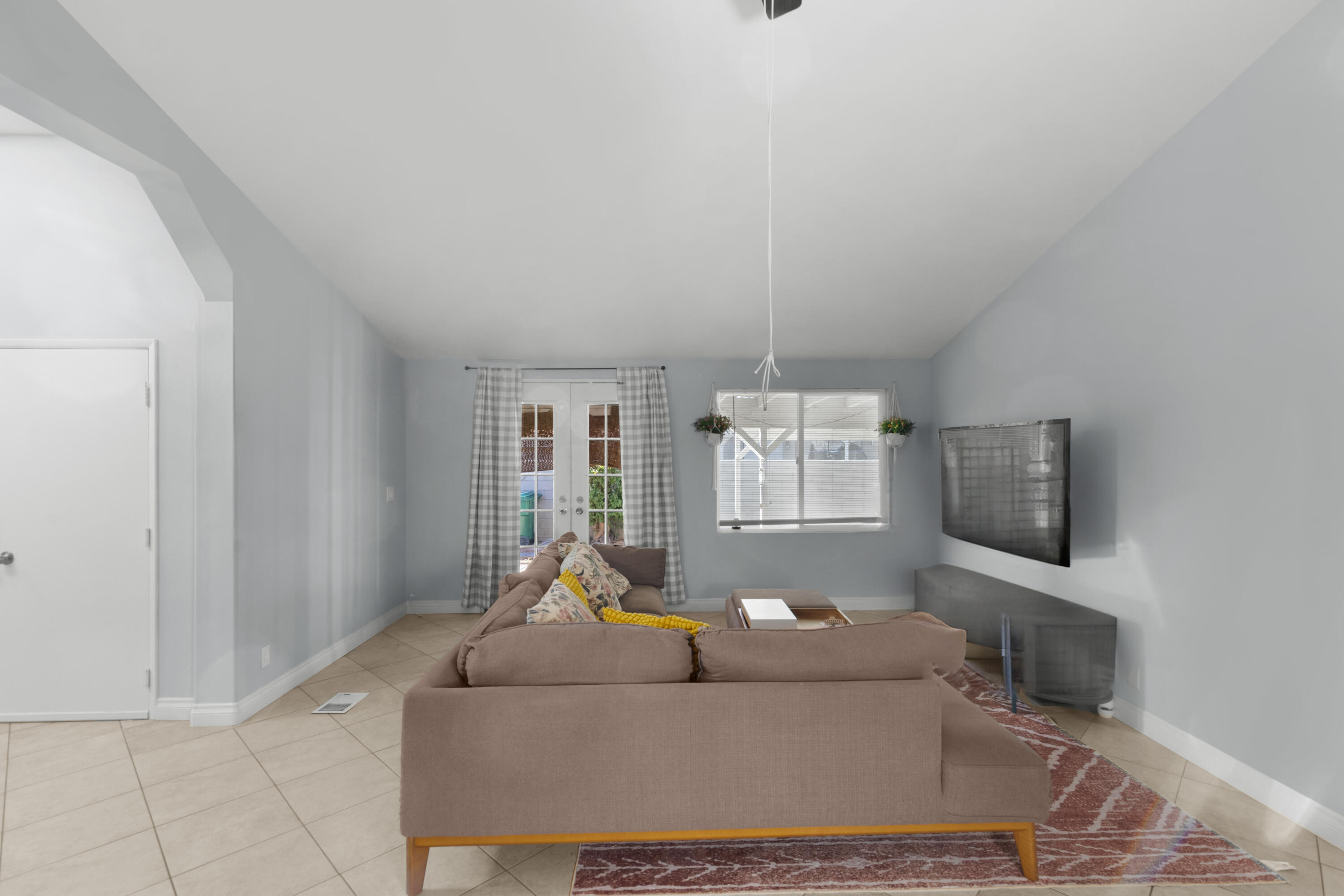 47800 Madison Street, Unit 44 Indio, CA 92201 - Photo 18 of 25 a living room with furniture and a flat screen tv