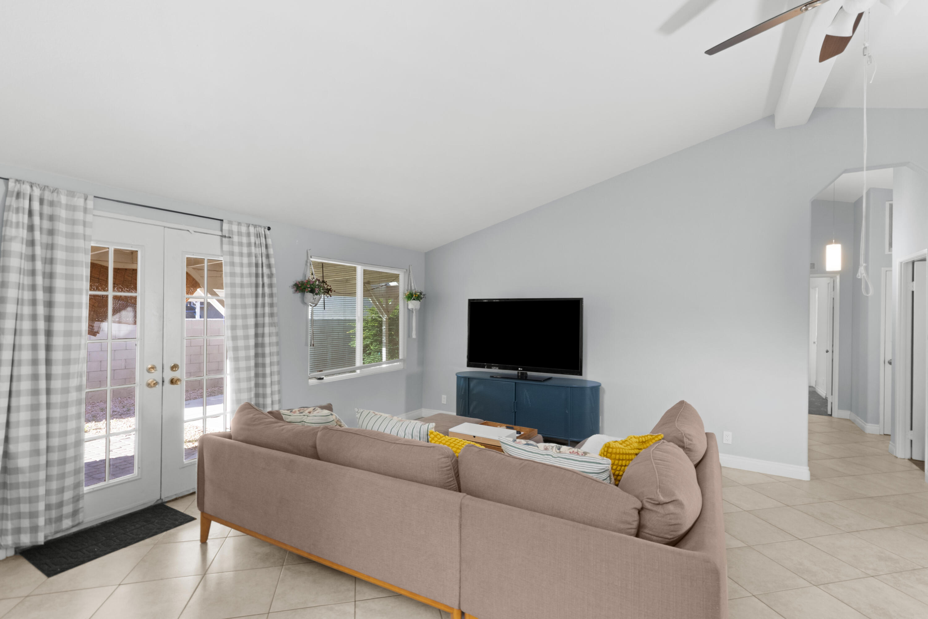 47800 Madison Street, Unit 44 Indio, CA 92201 - Photo 25 of 25 a living room with furniture and a flat screen tv