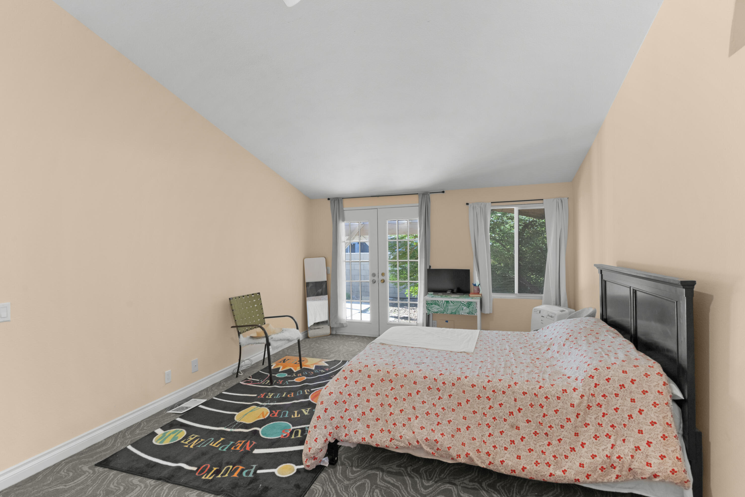 47800 Madison Street, Unit 44 Indio, CA 92201 - Photo 8 of 25 a bedroom with a bed and wooden floor