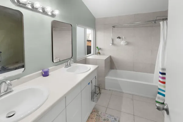 a bathroom with a sink a vanity and a mirror