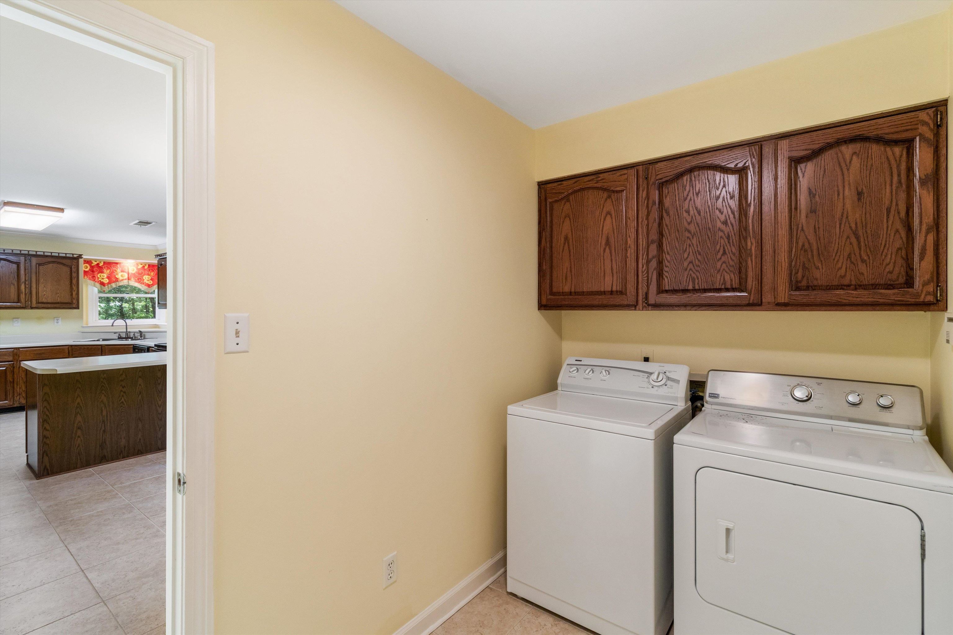 4081 Brunswick Road Bartlett, TN 38133 - Photo 15 of 31 Laundry area with cabinet space, separate washer and dryer, and light tile patterned flooring
