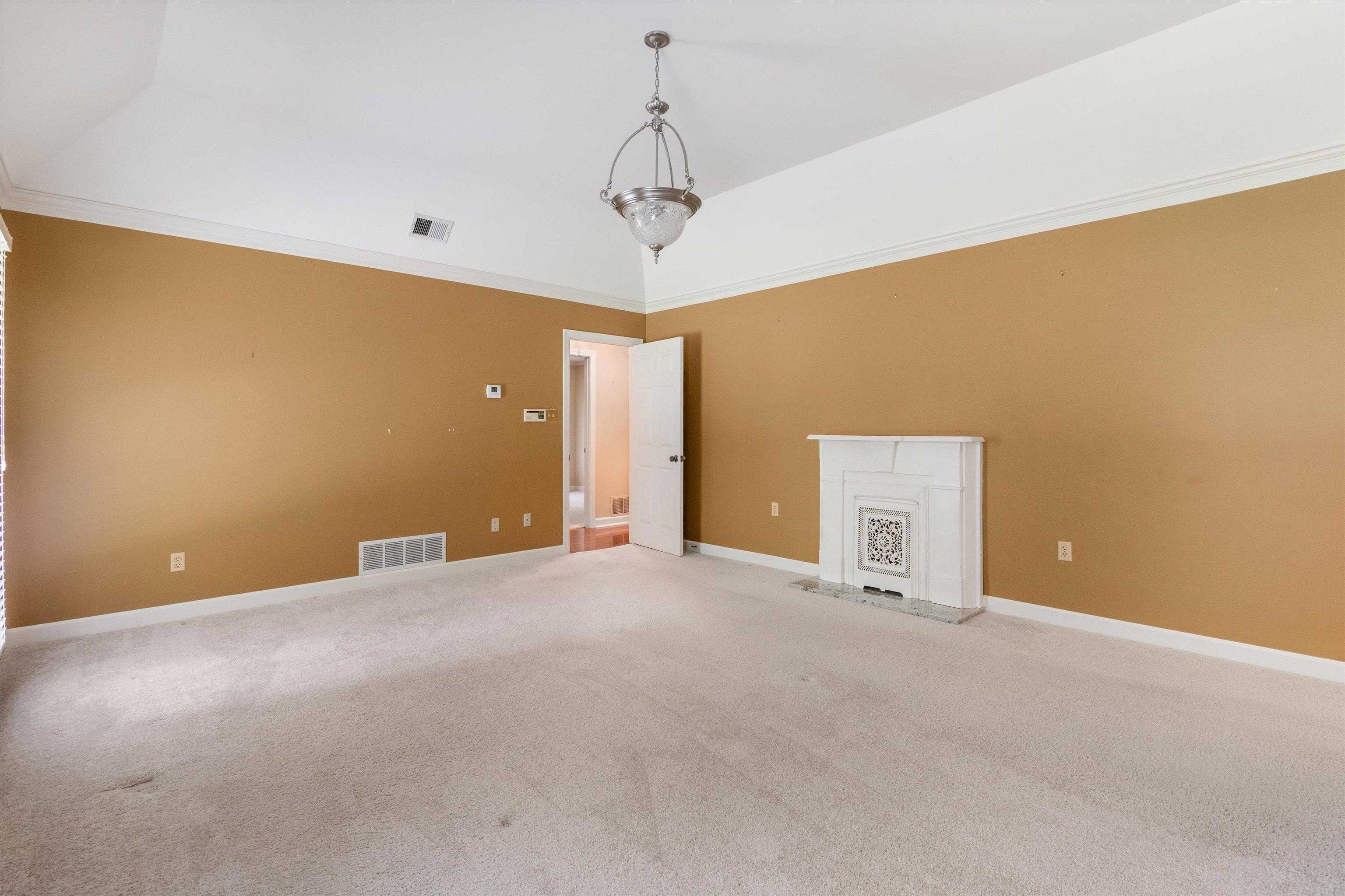 4081 Brunswick Road Bartlett, TN 38133 - Photo 17 of 31 Empty room with carpet and crown molding