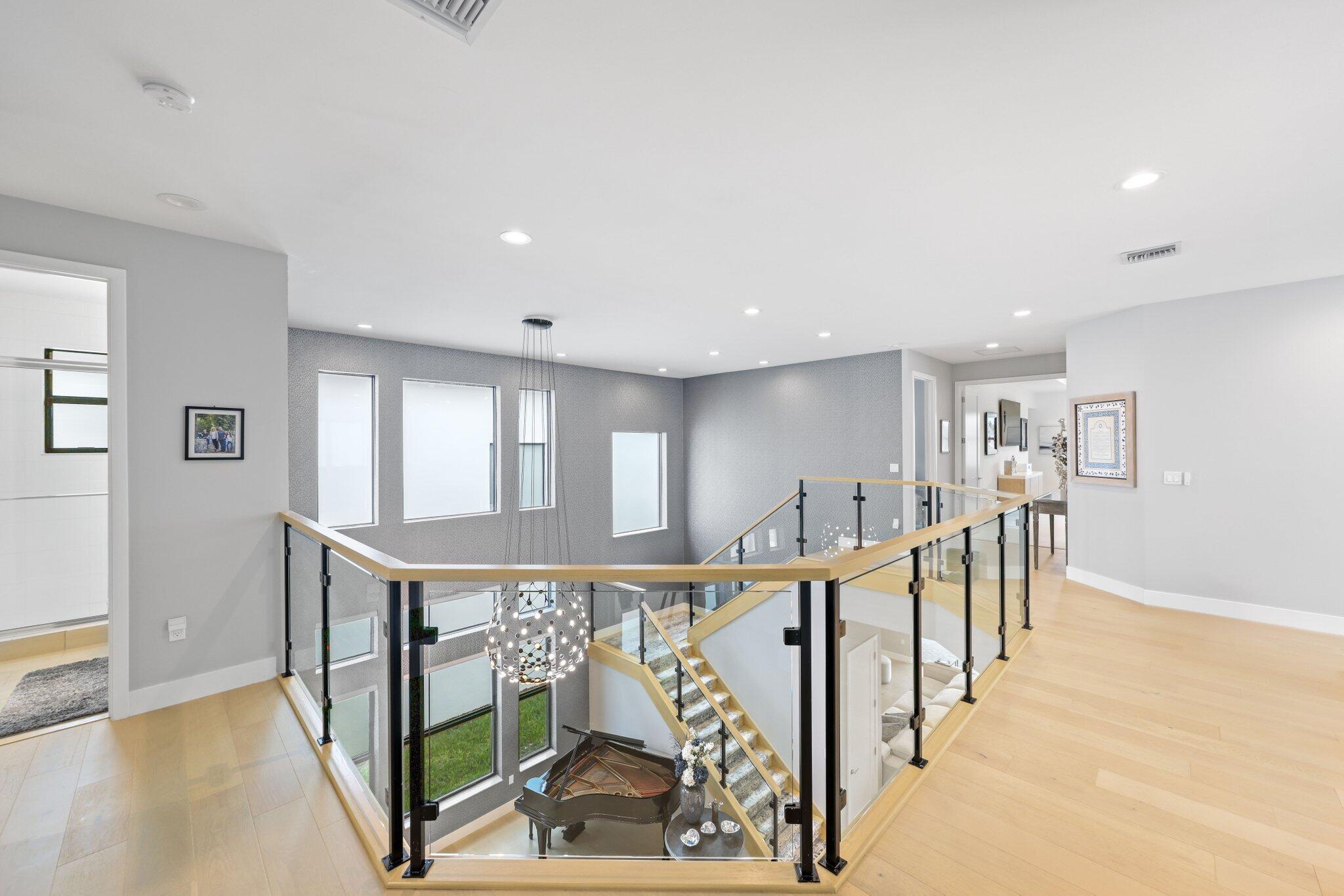 17048 Teton River Road Boca Raton, FL 33496 - Photo 30 of 69 a view of a hallway with wooden floor and windows