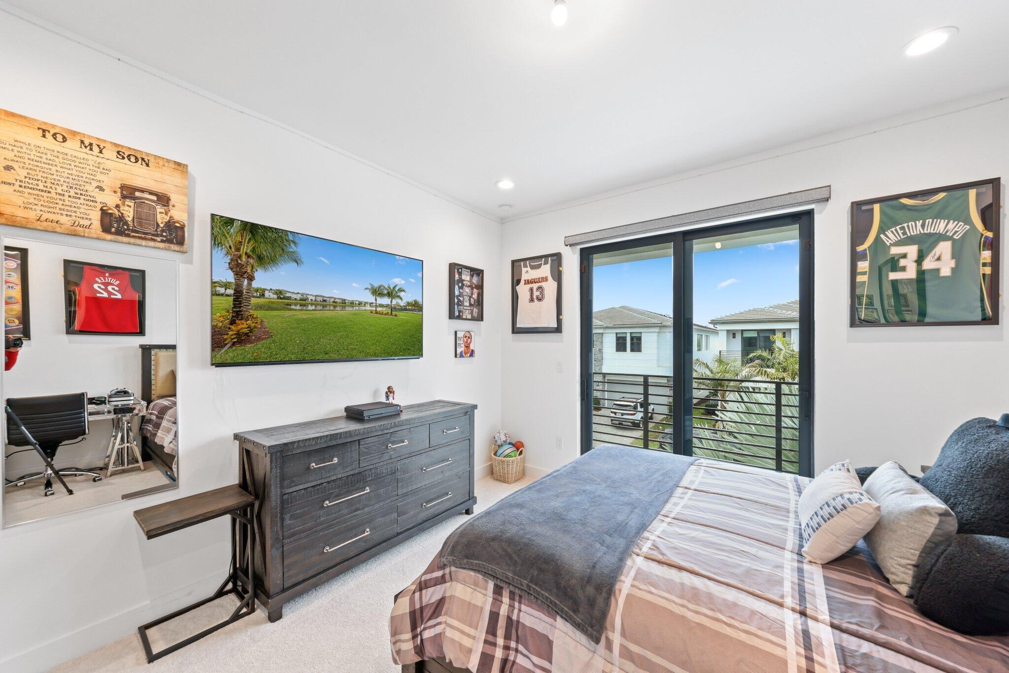 17048 Teton River Road Boca Raton, FL 33496 - Photo 54 of 69 a bedroom with a bed and furniture