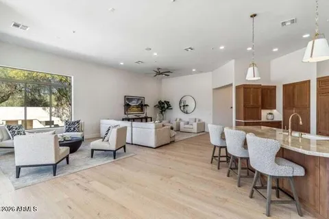 a kitchen with stainless steel appliances granite countertop a refrigerator and a stove top oven