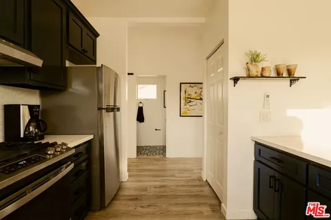 a kitchen with stainless steel appliances a stove and a refrigerator
