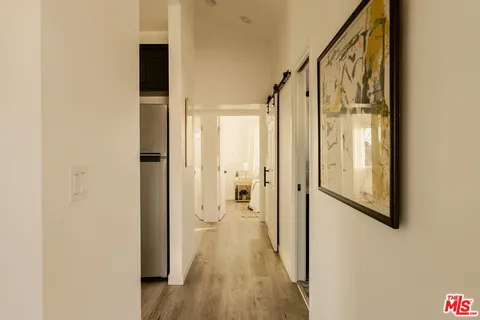 a view of a bathroom from the hallway