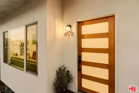 a bathroom with a shower and a window