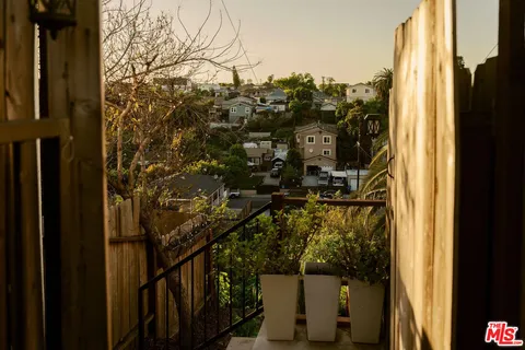 a view of a house with a tree
