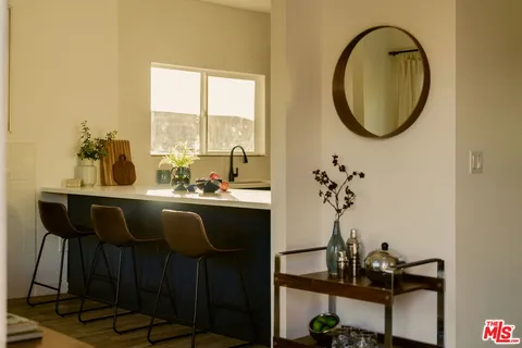 a dining room with table and chairs