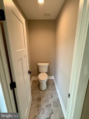 a bathroom with a toilet and a sink