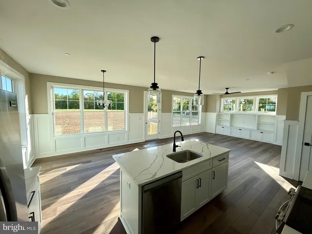 a kitchen with sink and window