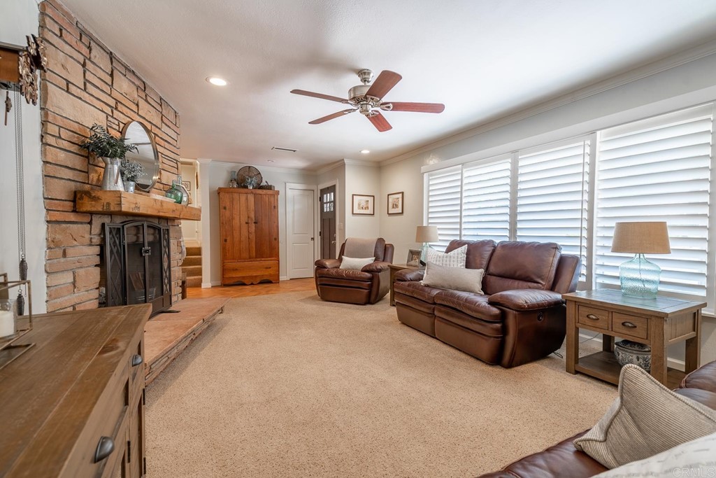 11493 Eucalyptus Hills Drive Lakeside, CA 92040 - Photo 14 of 30 a living room with furniture a fireplace and a large window