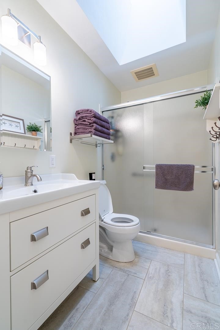 11493 Eucalyptus Hills Drive Lakeside, CA 92040 - Photo 21 of 30 a bathroom with a sink a toilet and shower