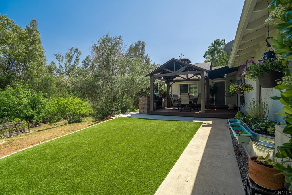 11493 Eucalyptus Hills Drive Lakeside, CA 92040 - Photo 26 of 30 a front view of a house with swimming pool having outdoor seating