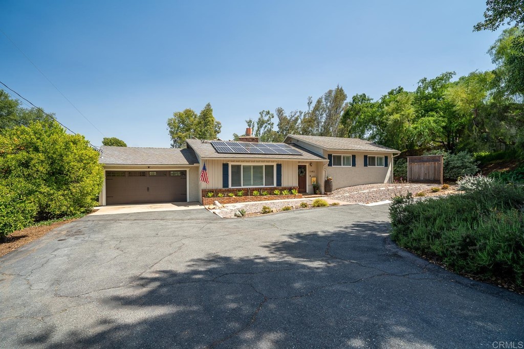 11493 Eucalyptus Hills Drive Lakeside, CA 92040 - Photo 30 of 30 a front view of a house with a yard and garage