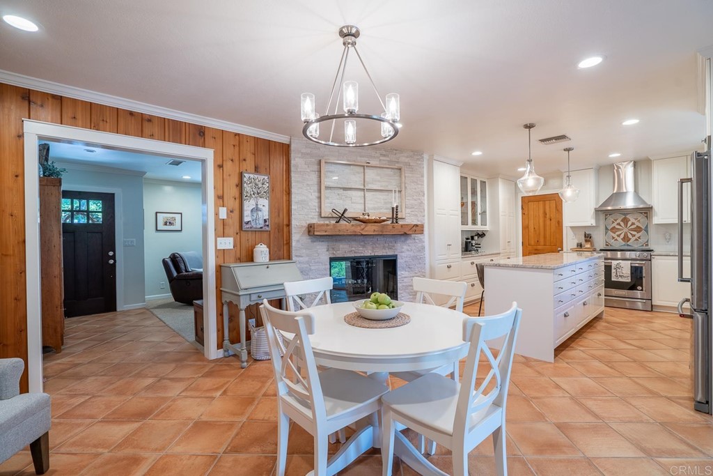 11493 Eucalyptus Hills Drive Lakeside, CA 92040 - Photo 6 of 30 a view of a dining room with furniture a chandelier and wooden floor