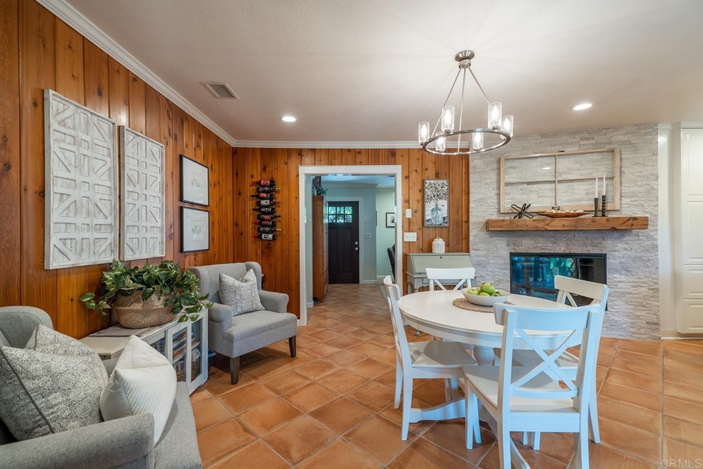 11493 Eucalyptus Hills Drive Lakeside, CA 92040 - Photo 9 of 30 a dining room with furniture a chandelier and wooden floor