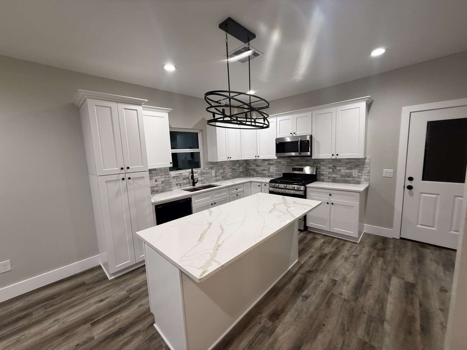 1620 Sam Wilson Street Houston, TX 77020 - Photo 11 of 40 a kitchen with granite countertop a refrigerator stove top oven and sink