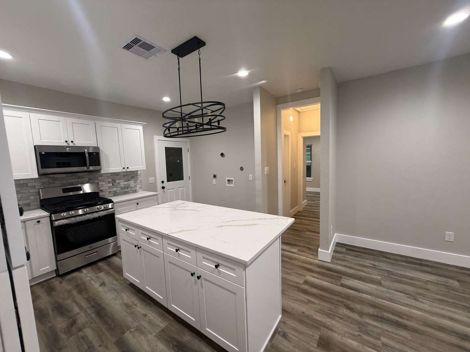 1620 Sam Wilson Street Houston, TX 77020 - Photo 20 of 40 a kitchen with stainless steel appliances kitchen island granite countertop a stove a sink and a refrigerator