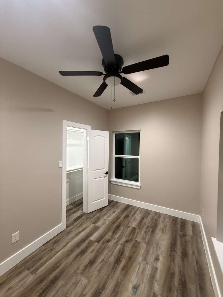 1620 Sam Wilson Street Houston, TX 77020 - Photo 24 of 40 a view of empty room with wooden floor and fan