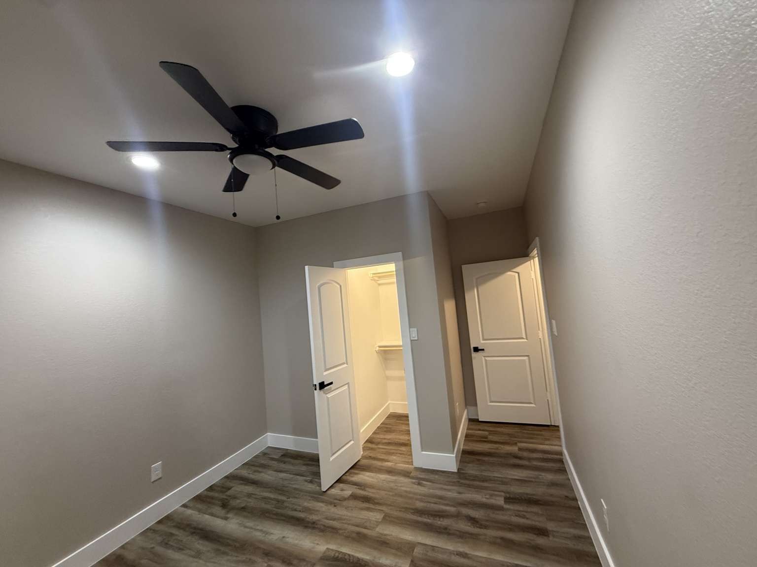 1620 Sam Wilson Street Houston, TX 77020 - Photo 27 of 40 an empty room with wooden floor and windows