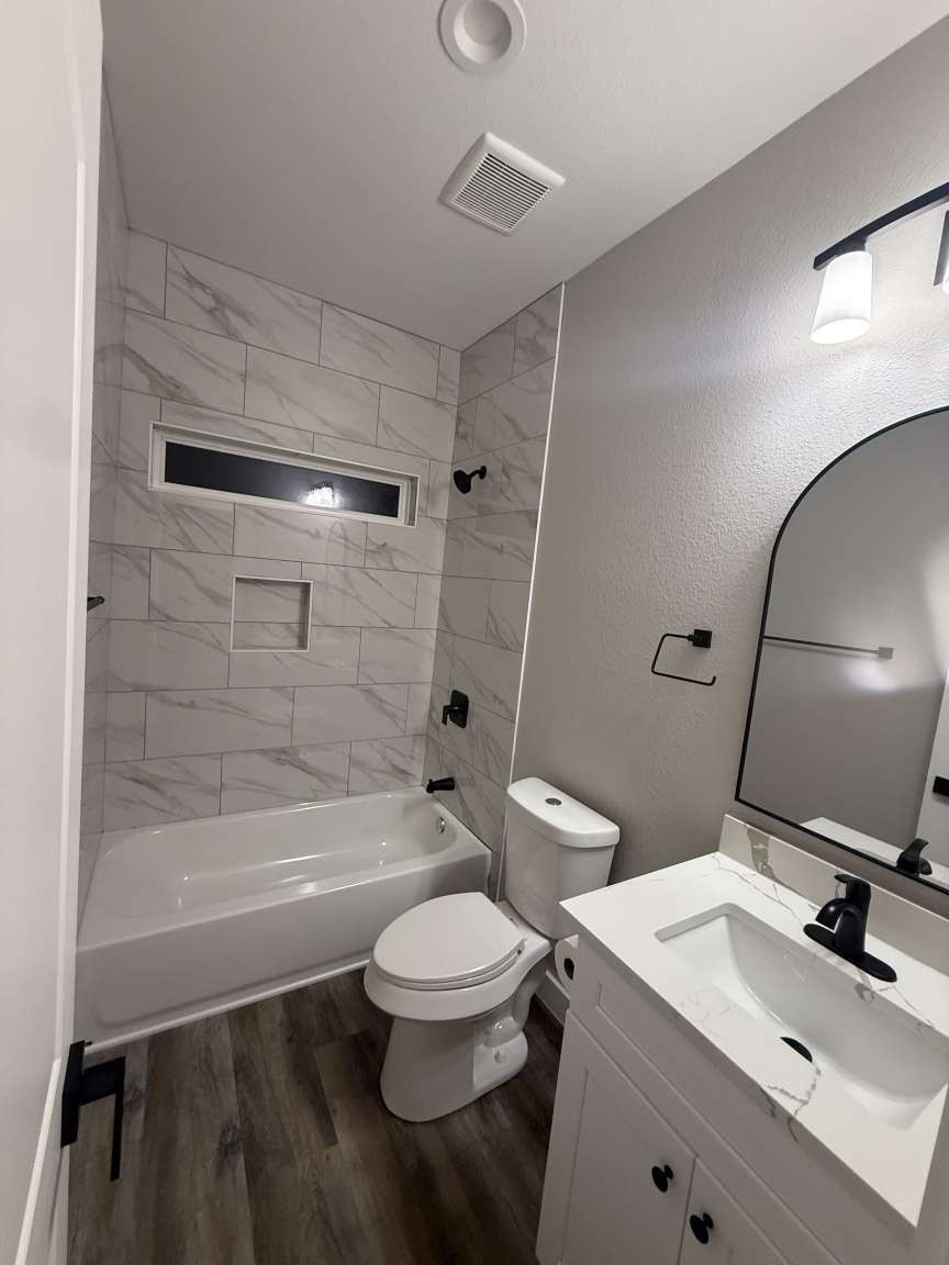 1620 Sam Wilson Street Houston, TX 77020 - Photo 28 of 40 a bathroom with a sink a toilet and shower
