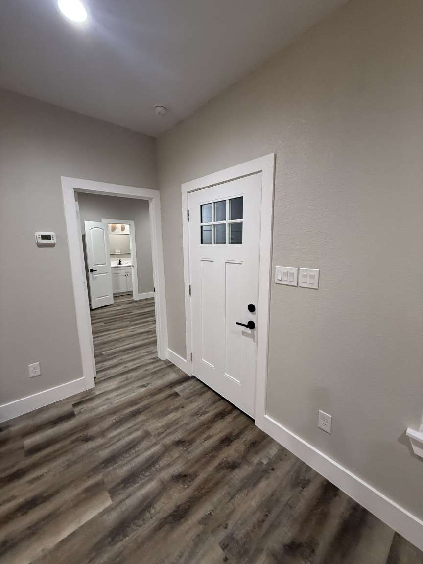 1620 Sam Wilson Street Houston, TX 77020 - Photo 33 of 40 a view of a hallway with wooden floor and a bathroom
